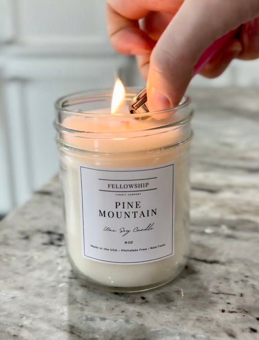 Fellowship Pine Mountain Non toxic soy candle being lit