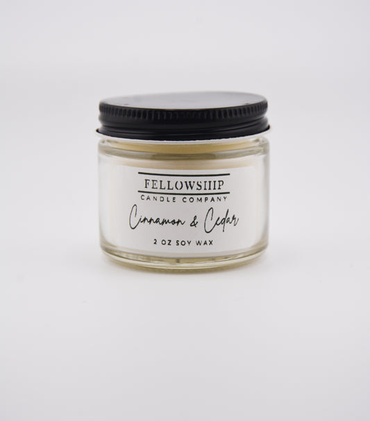 Candle jar with 'Fellowship Candle Company' label on a white background