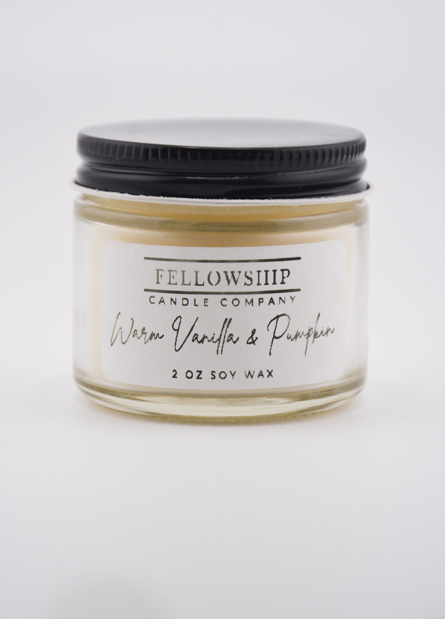 Fellowship Candle Company candle jar with 'Warren Vanilla & Pumpkin' scent on a white background