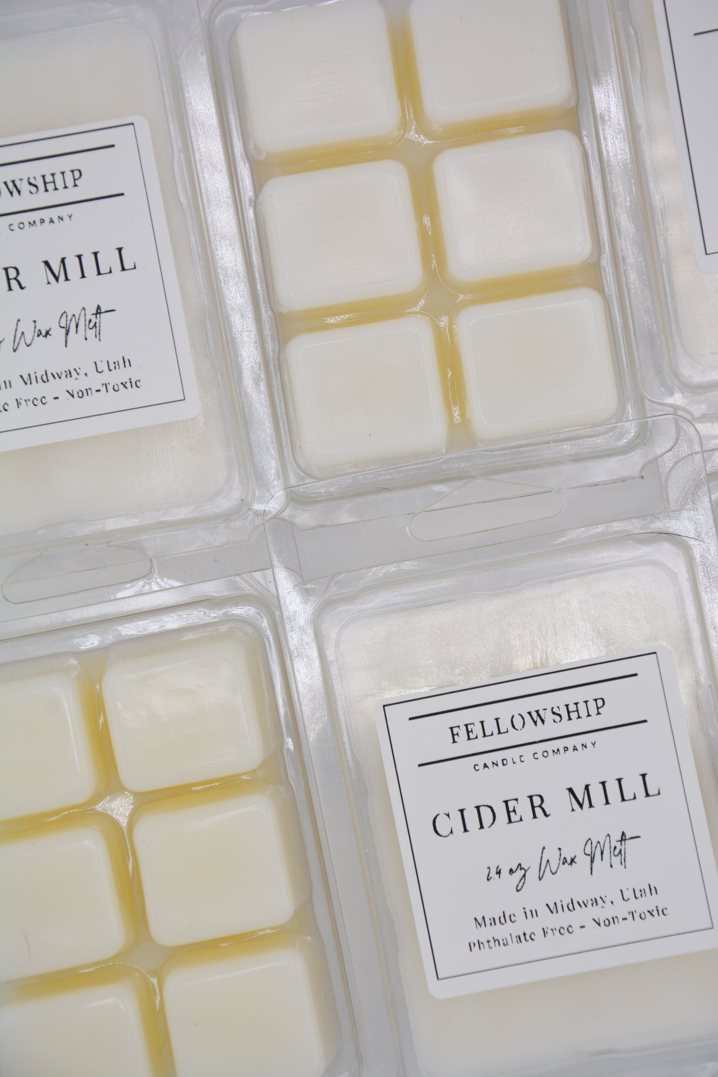 Wax melts in packaging with 'Fellowship Candle Company' labels.