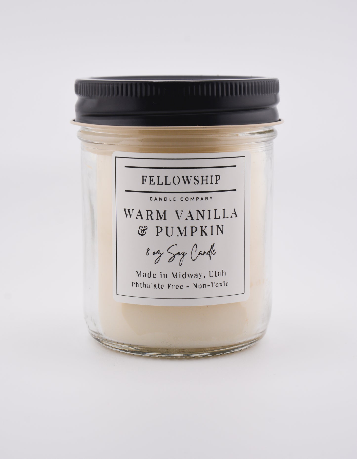 Candle with a label on a white background