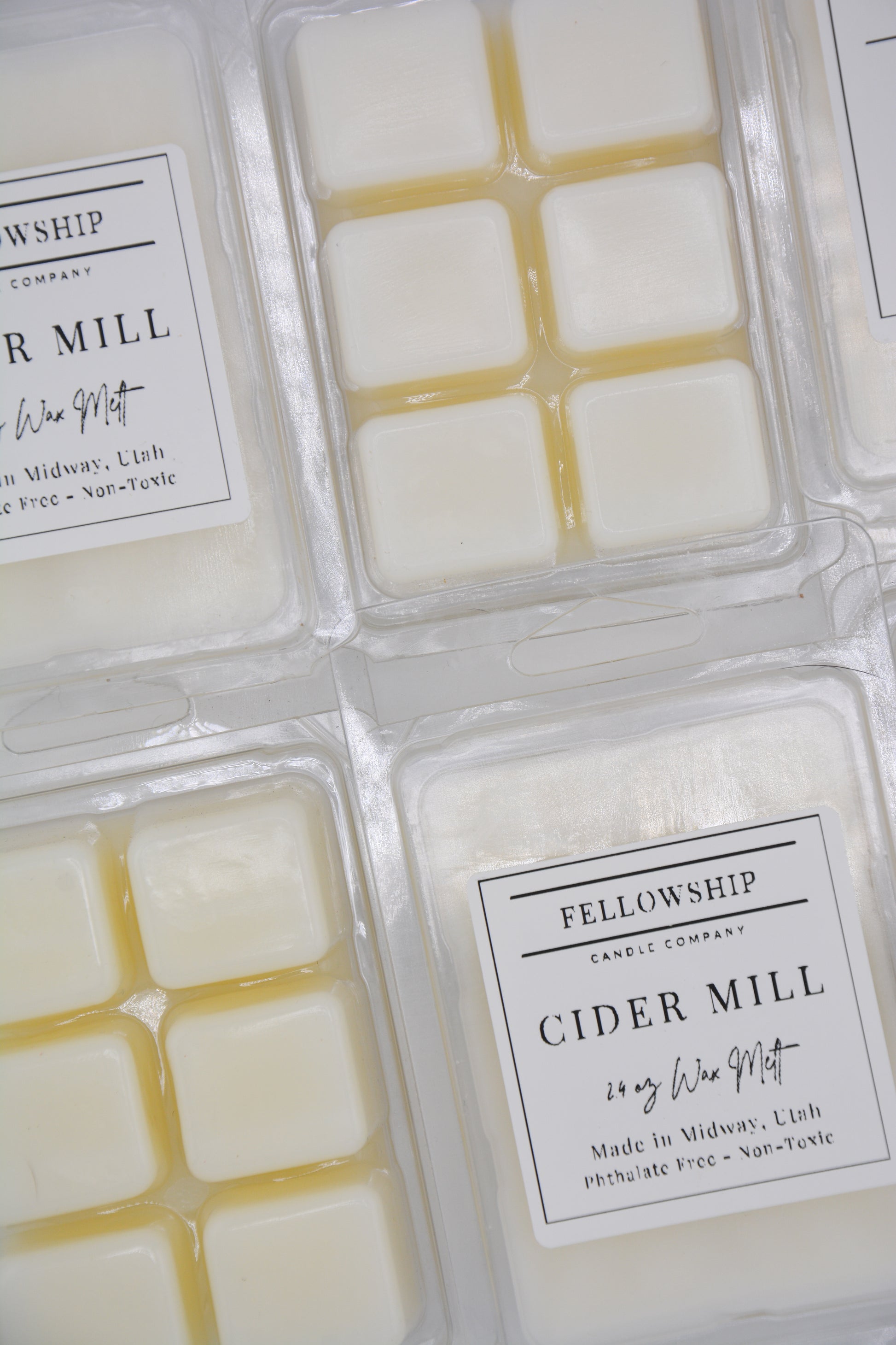 Wax melts in packaging with 'Fellowship Candle Company' labels.