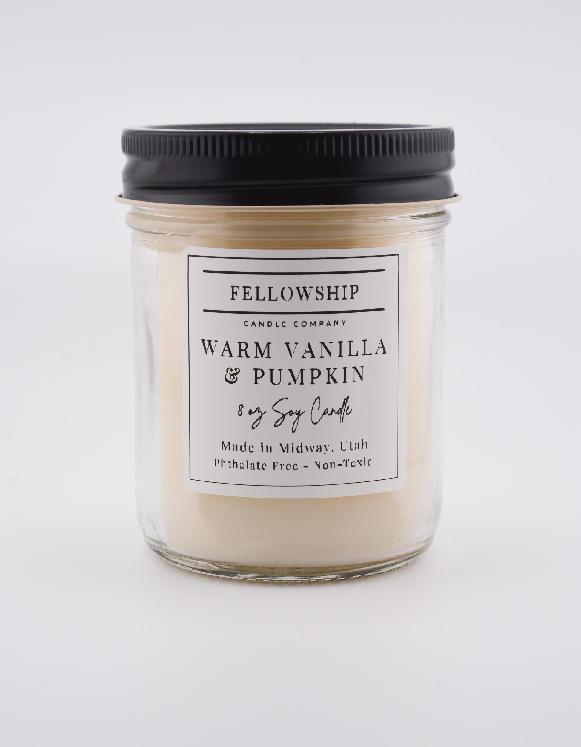 Candle with a label on a white background
