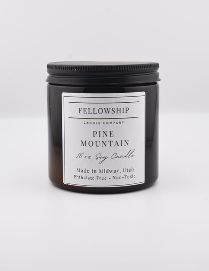 Fellowship Candle Co. candle with a white label on a white background