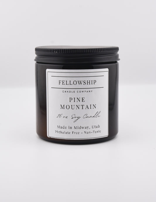 Fellowship Candle Co. candle with a white label on a white background
