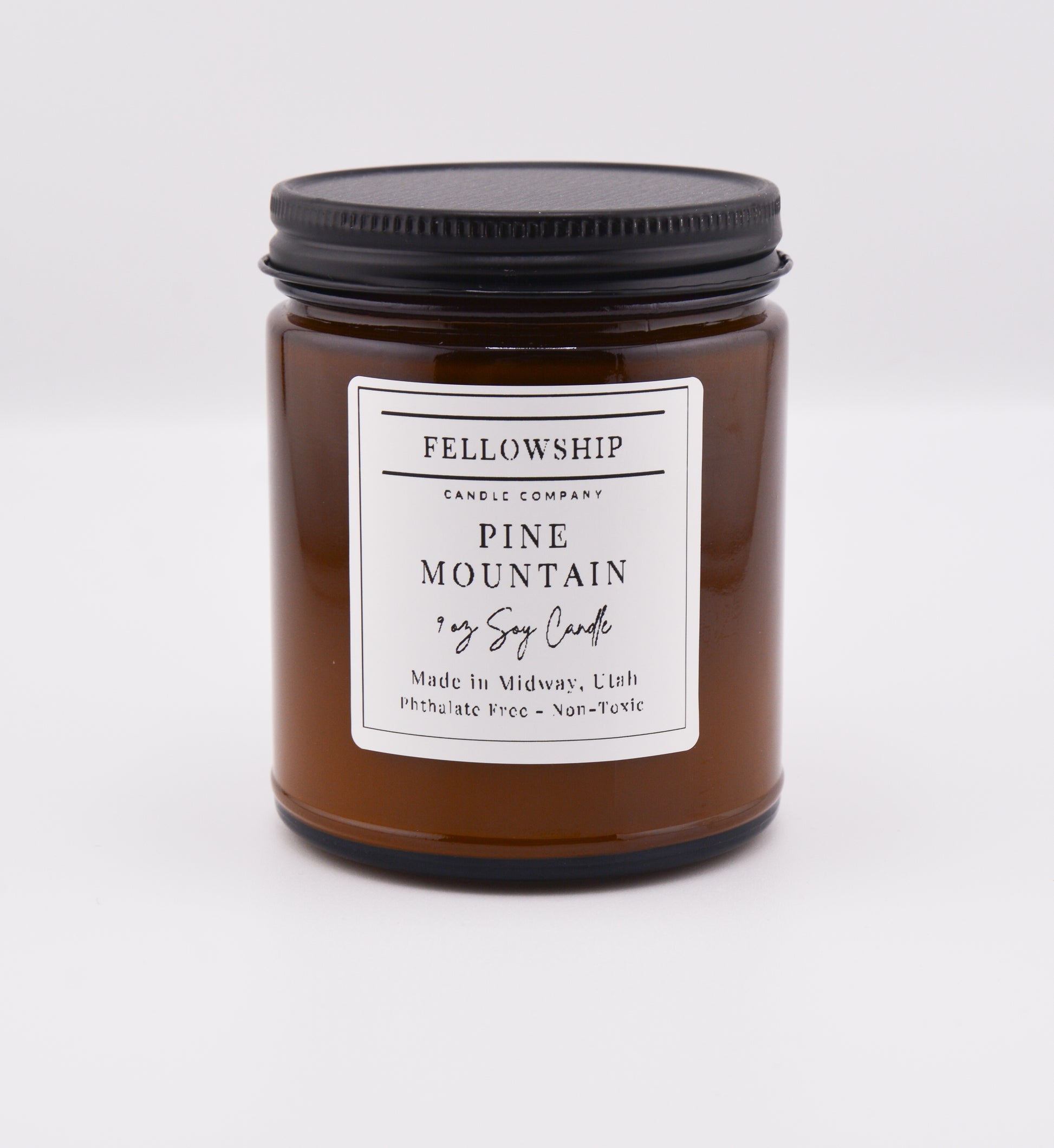Fellowship Candle Co. Pine Mountain Candle with a label on a white background