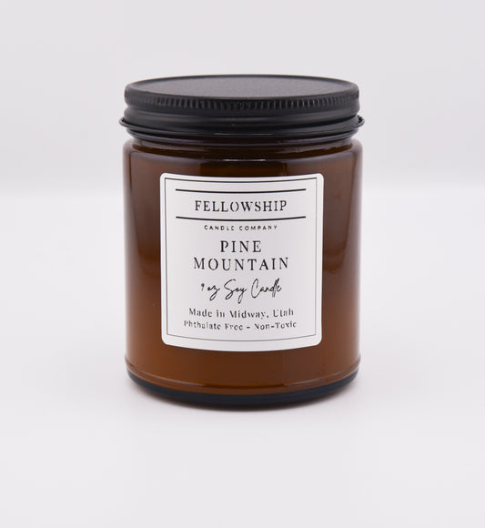 Fellowship Candle Co. Pine Mountain Candle with a label on a white background