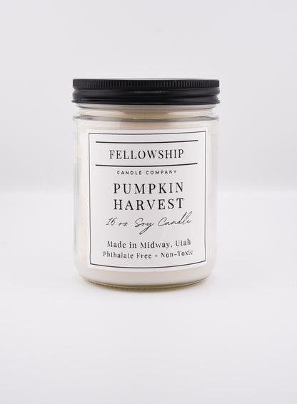 Candle with 'Fellowship Candle Company' label on a white background