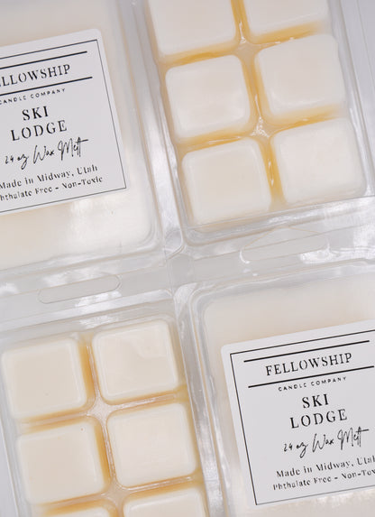 Packaged wax melts with 'Fellowship Candle Company' labels on a white background