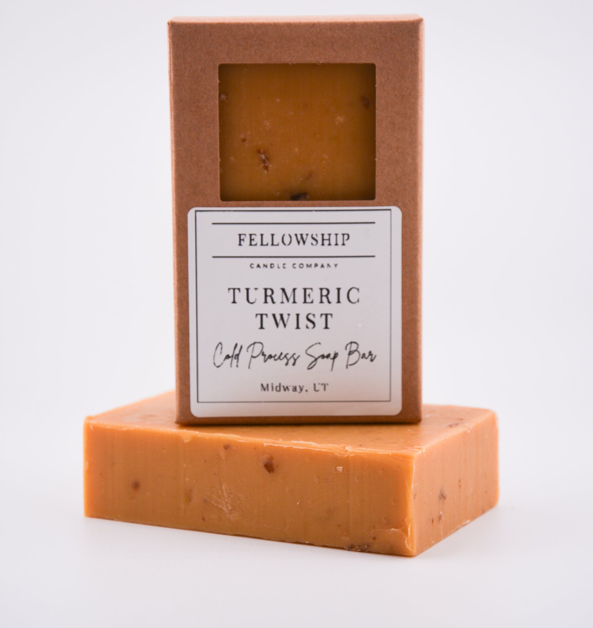 Bar of soap with a 'Fellowship Candle Company' label on a white background